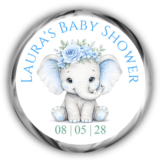 A round custom baby shower sticker featuring a cute watercolor-style baby elephant with a blue flower crown. 