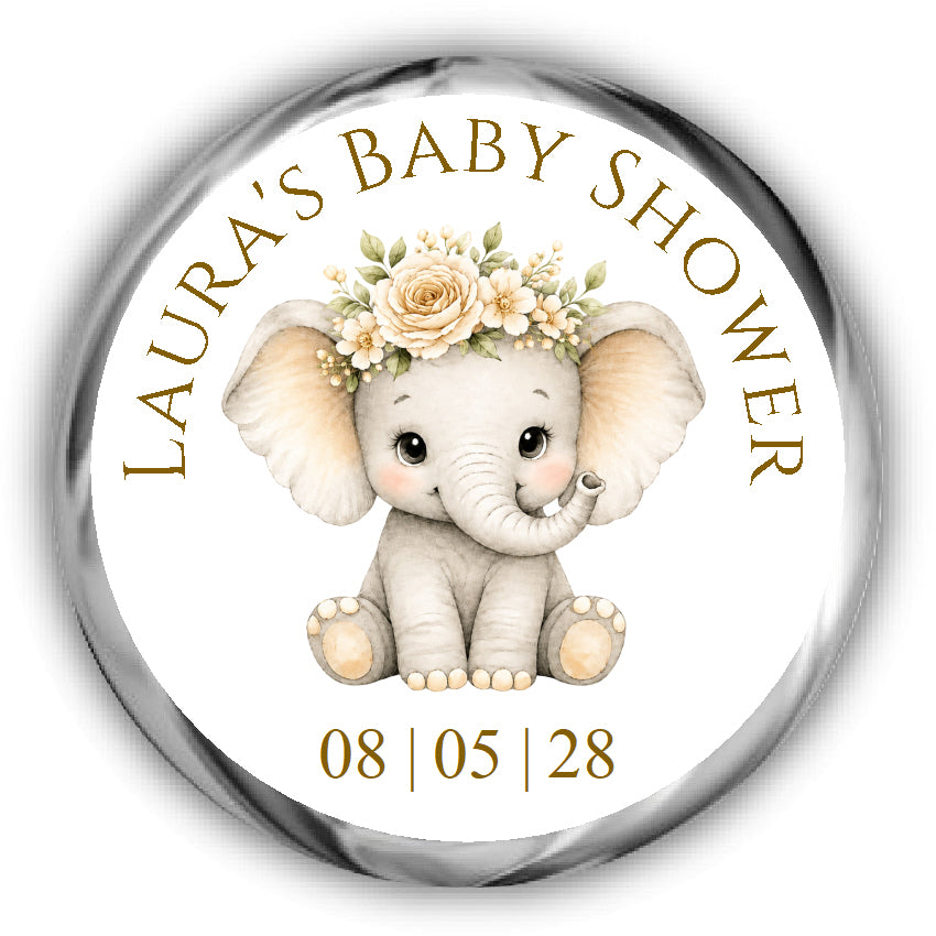A round custom baby shower sticker featuring a cute cartoon elephant wearing a floral crown