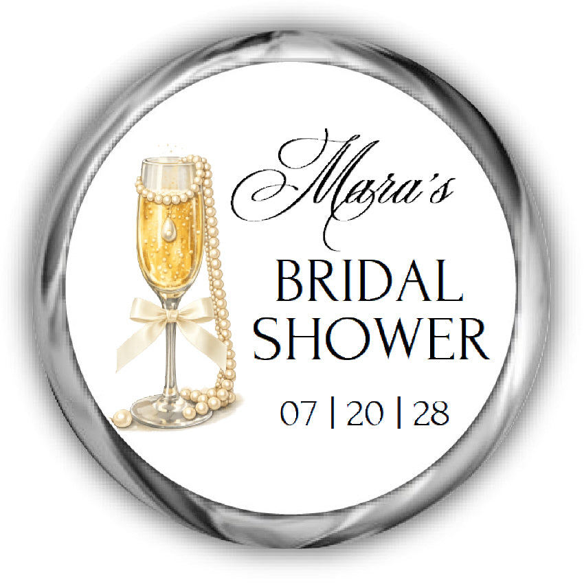 Sticker with champagne glass, pearls, and text for a bridal shower on a white background