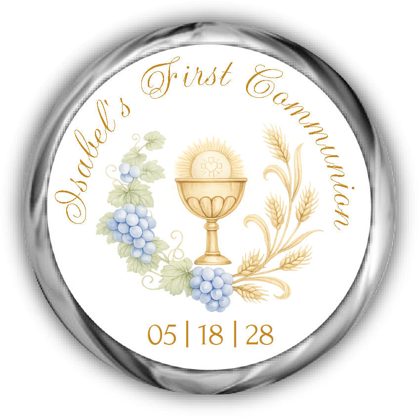 A round personalized First Communion sticker. The design includes the text in gold cursive, a gold chalice with a radiant emblem, blue grapes, green leaves, and gold wheat stalks.