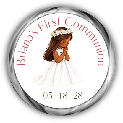 A round custom first communion sticker featuring an illustration of a young girl with brunette hair and tan skin in a white dress with a flower crown, surrounded by the text.