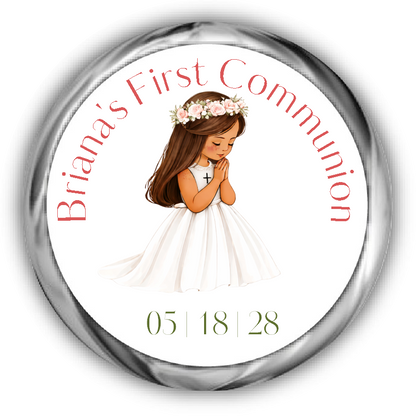 A round custom first communion sticker featuring an illustration of a young girl with brunette hair and tan skin in a white dress with a flower crown, surrounded by the text.