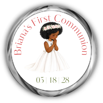 A round custom first communion sticker featuring an illustration of a young girl with curly hair and dark tan skin in a white dress with a flower crown, surrounded by the text.