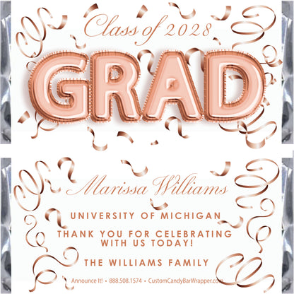 Graduation-themed candy bar wrapper with 'GRAD' text and rose gold accents.
